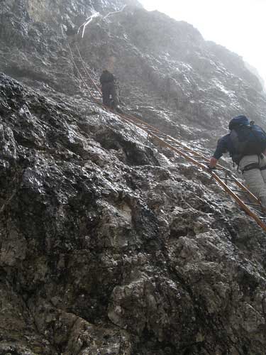 Climbing Via Ferrata Merlone in the rain. Copyright Haydn Williams 2008.