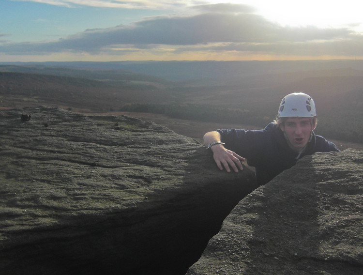 A relieved Ben tops out on Wobblestone Crack (HVD 4a). Copyright Haydn Williams 2009.
