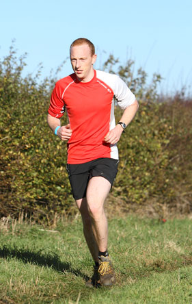 Mile 15. This is my "It hurts but I must man-up for the camera" face.