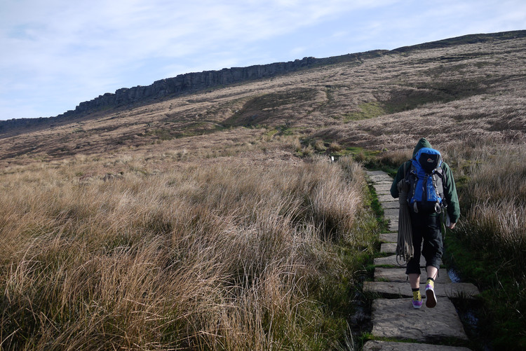 Ben heading up to Stanage Popular End. Copyright Haydn Williams 2011.