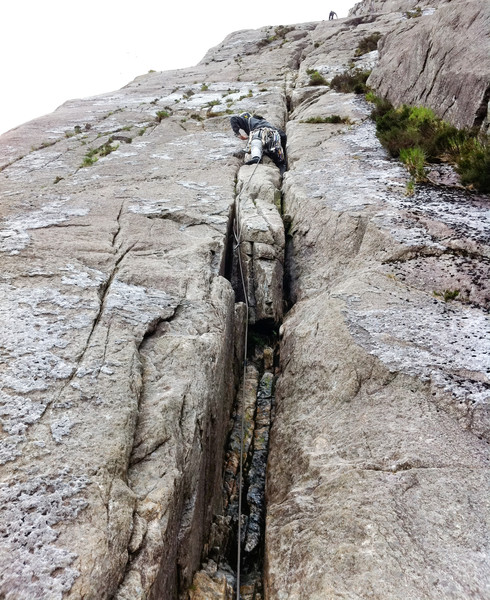 Starting up Ordinary Route (Diff). Climber at the top is just about the belay I'm heading for. Copyright Haydn Williams 2011. Photo by Gary Mirams.