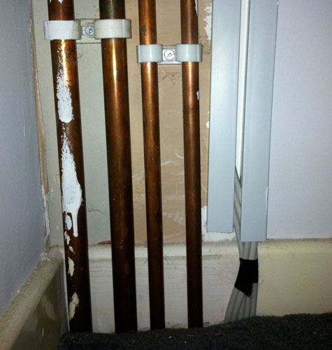 Cables running from the loft down to below the floorboards. Copyright Haydn Williams 2011