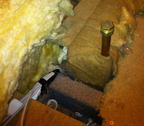 Cables running in the loft and down through the ceiling. Copyright Haydn Williams 2011