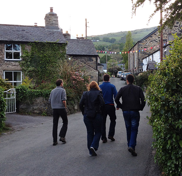 The return from the pub - the hostel is just about visible near the skyline. The bunting was put up specifically for our arrival. © Haydn Williams 2014