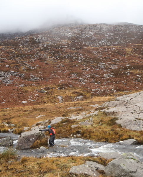 James fording the outflow of Llyn Cwnffynnon. It got substantially deeper two seconds later. © Haydn Williams 2014