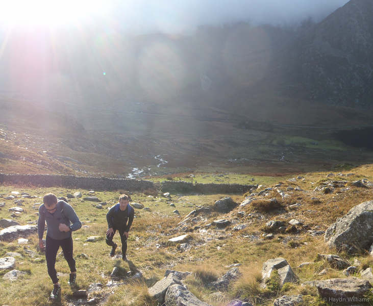 Contrast: sunny as we climb Pen yr Ole Wen, but grim on Tryfan. © Haydn Williams 2014