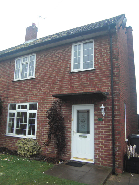 Our house, in the middle of our street, etc.