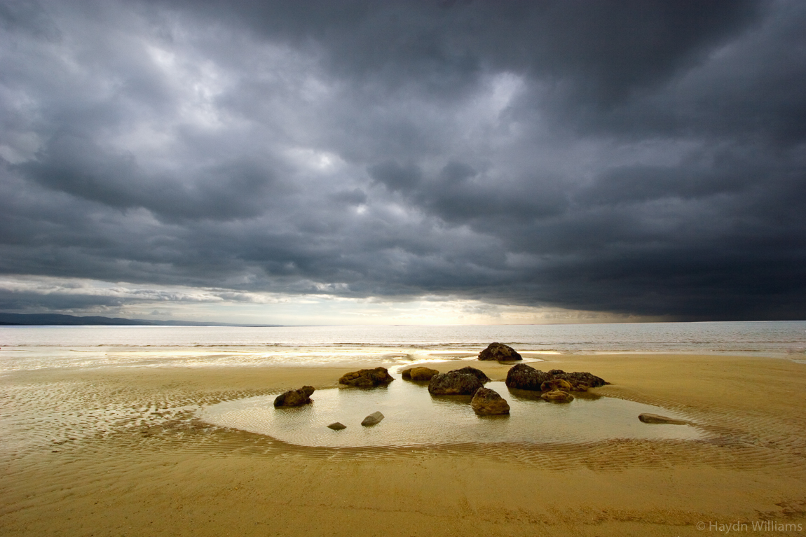 Storm clouds over Criccieth Beach. © Haydn Williams 2006