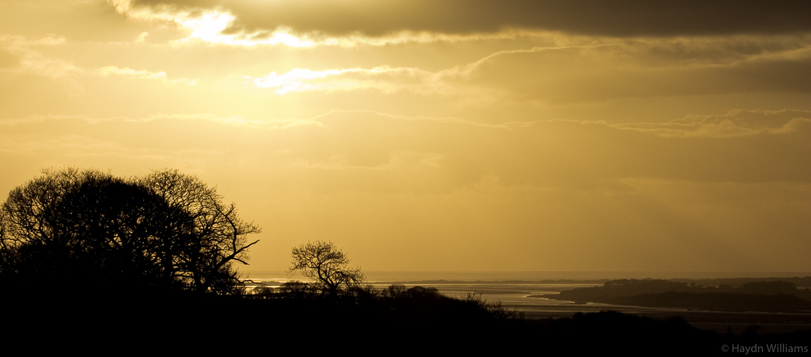 Sunset over the Menai Straits and Anglesey. © Haydn Williams 2004