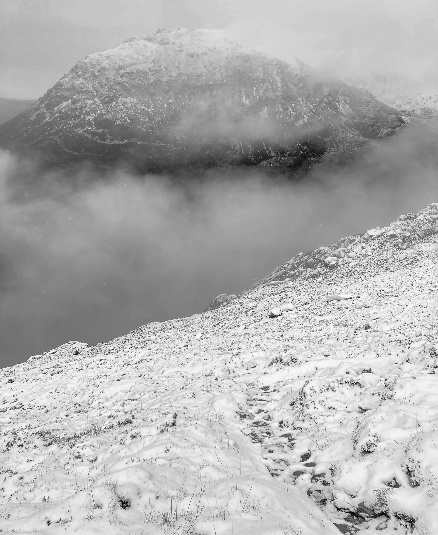 Snowy Pen yr Ole Wen seen with the Tryfan footpath in the foreground. © Haydn Williams 2025