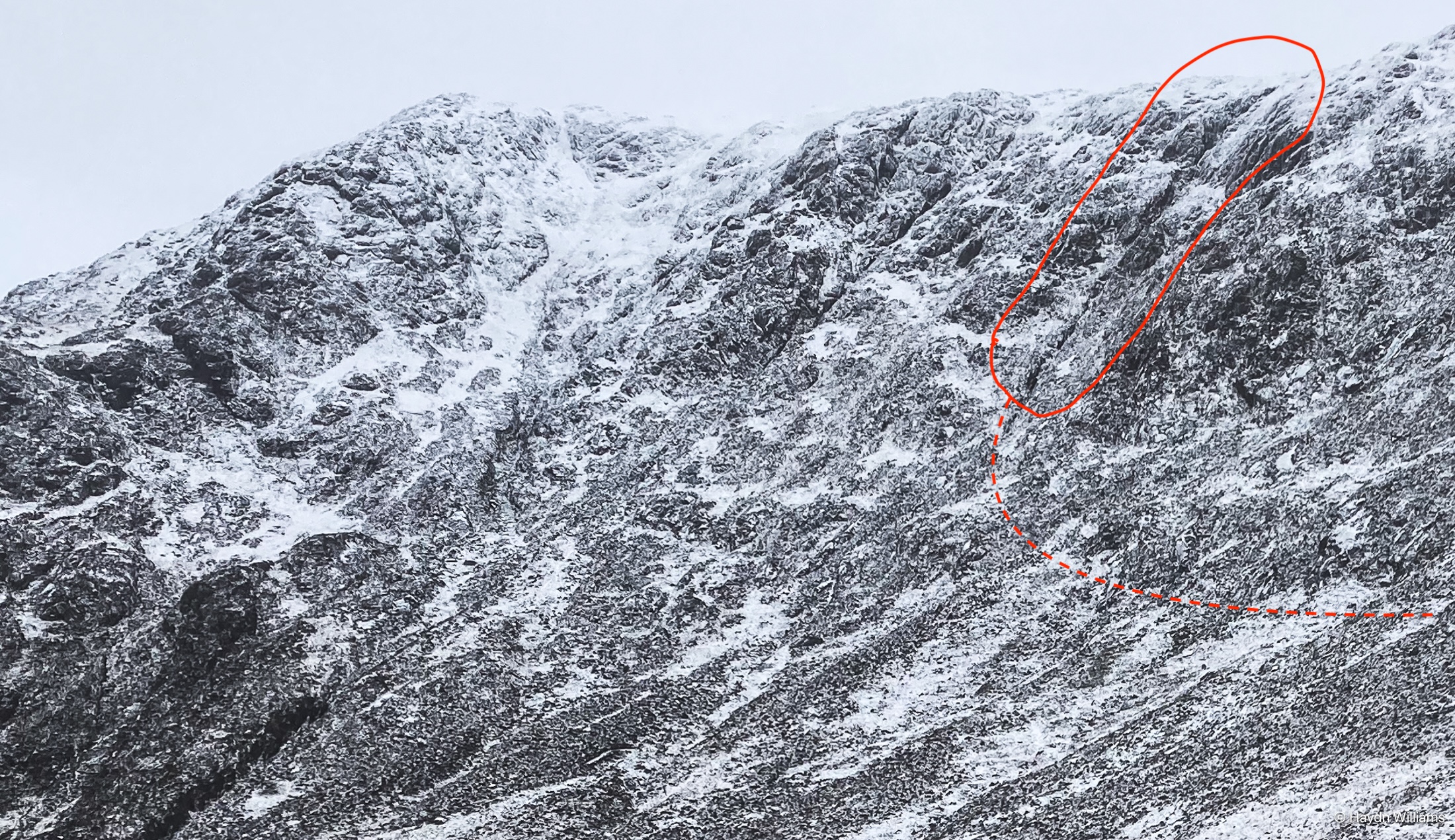 A snowy mountainside, with the climbing route highlighted. © Haydn Williams 2025